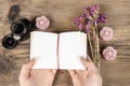 Handwritten diary: woman holding hardcover notebook