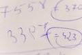 Handwritten digits with a pen on a piece of paper. Photo with very close up.