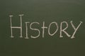 Handwritten inscription in chalk history on a green board Royalty Free Stock Photo