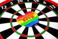 Handwritten inscription love on paper heart painted rainbow colored crayons glued to dartboard on sunny day Royalty Free Stock Photo