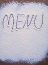 Handwritten inscription menu is made with flour on