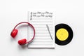 Handwritten music sheets and headphones, top view. Compose music concept