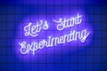 Neon glowing text Lets Start Experimenting on blue wall. Trendy classic color