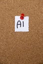 A handwritten note displaying the text AI is pinned on a cork board with a red thumbtack. The note indicates a focus on Royalty Free Stock Photo
