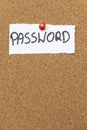 Handwritten note displaying the word PASSWORD pinned to a corkboard, emphasizing security and confidentiality in a moder Royalty Free Stock Photo