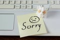 Handwritten note is on the keyboard. - I`m Sorry. Small delicate