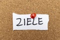 Handwritten note reading ZIELE pinned to a cork board. Represents goals and objectives, often used for personal developm Royalty Free Stock Photo