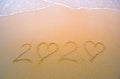 2020 handwritten numeric text on the sand by the beach, Numbers 2020 year on the sand, Happy New Year 2020, Zeros represented by Royalty Free Stock Photo