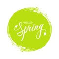 Handwritten phrase Hello Spring with leaves and green circle brush stroke background.