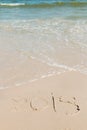 Handwritten ` 2018 ` on a sand of beach Royalty Free Stock Photo