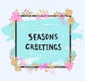 Handwritten seasons greetings text. Frame of flowers. Royalty Free Stock Photo