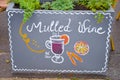 Handwritten sign mulled and simple drawing of a mulled wine glass with orange and cinnamon. Original ad attracting