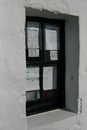 Handwritten signs and menu in window of a fish and chip shop, Scotland