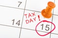 Handwritten Tax day for reminde apointment with wooden pin