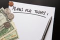 Handwritten text Plans for today on sheet of paper dollars, coinsf Royalty Free Stock Photo