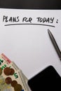 Handwritten text Plans for today on sheet of paper, euros and coins Royalty Free Stock Photo