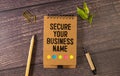 Handwritten text SECURE YOUR BUSINESS NAME, business success concept