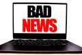 Handwritten text showing Bad News. Business concept writing for Failure Media Newspaper Written on monitor front screen, white bac Royalty Free Stock Photo