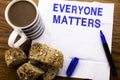 Handwritten text showing Everyone Matters. Business concept for Equality Respect written on tissue paper on the wooden background