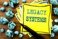 Handwritten text showing Legacy Systems. Business concept for Upgrade SOA Application Written on sticky note paper, wooden backgro