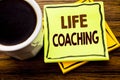 Handwritten text showing Life Coaching. Business concept for Personal Coach Help written on sticky note paper on the wooden wood b Royalty Free Stock Photo