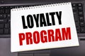 Handwritten text showing Loyalty Program. Business concept writing for Marketing Concept written on notepad note paper on the blac