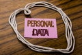 Handwritten text showing Personal Data. Business concept for Digital Protection written on sticky note paper on the dark wooden ba Royalty Free Stock Photo