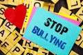 Handwritten text showing Stop Bullying. Conceptual photo Awareness Problem About Violence Abuse Bully Problem written on colorful Royalty Free Stock Photo