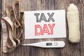 Handwritten text showing Tax Day. Business fitness health concept writing for Income taxation Refund written sticky note empty pap Royalty Free Stock Photo