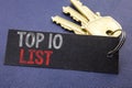 Handwritten text showing Top 10 Ten List. Business concept writing for Success ten list Written on note paper attached to the key,
