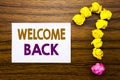 Handwritten text showing Welcome Back. Business concept for Emotion Greeting Written on sticky note paper, wooden background with Royalty Free Stock Photo