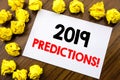 Handwritten text showing word 2019 Predictions. Business concept writing Forecast Predictive Written on sticky note paper, wooden Royalty Free Stock Photo