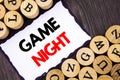 Handwritten text sign showing Game Night. Business concept for Entertainment Fun Play Time Event For Gaming written on White Stick