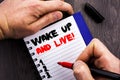 Handwritten text sign showing Wake Up And Live. Conceptual photo Motivational Success Dream Live Life Challenge written on Noteboo