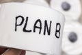 Handwritten text on toilet paper displaying the phrase PLAN B, emphasizing preparedness and alternative solutions. Ideal Royalty Free Stock Photo