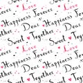 Handwritten vintage ink cursive font pattern with pink watercolor hearts