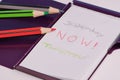 Handwritten words: yesterday, now, tomorrow on a white notepad Royalty Free Stock Photo