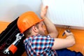 Handy man repairing heater Royalty Free Stock Photo