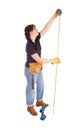 A handy woman measuring for work. Royalty Free Stock Photo