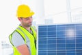 Handyman carrying solar panel at office Royalty Free Stock Photo