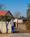 Handyman doing upkeep work on the exterior of a house