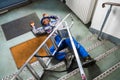 Handyman Fallen From Ladder Lying On Floor Royalty Free Stock Photo