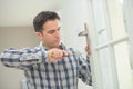 Handyman fitting new door Royalty Free Stock Photo