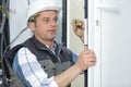 Handyman fitting new door Royalty Free Stock Photo