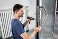 Handyman Fitting A New Door Royalty Free Stock Photo