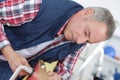 Handyman fixing lock in door with screwdriver Royalty Free Stock Photo