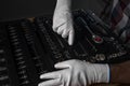 Handyman hands in white building gloves over open toolbox with new steel tools for car and home repair, close up