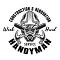 Handyman in hard hat and two crossed hammers vector vintage emblem, label, badge or logo for construction company Royalty Free Stock Photo