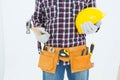 Handyman holding hard hat and hammer Royalty Free Stock Photo