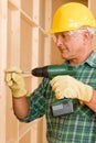 Handyman home improvement working with screwdriver